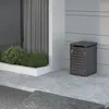 A dark gray trash can enclosure is shown next to a modern building with a window and plants. Náhľad obrázku produktu