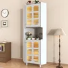 A white corner cabinet with glass doors and LED lighting is shown in a room with a clock, a framed picture, and a floor lamp. Produktbild-Vorschau