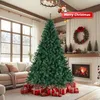 A decorated Christmas tree in a living room with presents underneath, a fireplace, and a wreath on the wall. Podgląd zdjęcia produktu