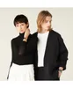 A man and a woman posing together, both wearing watches. Voir les images du produit