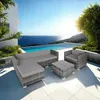 A patio set with a sectional sofa, armchair, and coffee table is arranged on a tiled patio overlooking a swimming pool and the ocean. Voir les images du produit