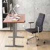 A modern office setup with a standing desk, computer, lamp, and chair. Náhled obrázku produktu