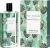 A perfume bottle and its packaging, both decorated with a tropical leaf pattern. Náhľad obrázku produktu