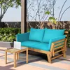 A wooden garden sofa with blue cushions is placed on a patio next to a small wooden table with a laptop on it. Anteprima dell’immagine prodotto