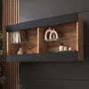 A modern wall-mounted display cabinet with wooden interior and black exterior, showcasing decorative items and books. Náhľad obrázku produktu