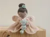 A plush fairy doll sitting on a wooden crate. Náhled obrázku produktu