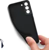 A hand is holding a black phone case, showing its texture and camera cutout. Náhľad obrázku produktu