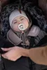 A baby sleeping in a stroller, bundled up in a winter footmuff. Náhled obrázku produktu
