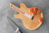 A guitar-shaped cutting board with tomatoes and a knife on a gray surface. Náhľad obrázku produktu