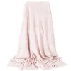 A pink textured blanket draped over a surface. Anteprima dell’immagine prodotto