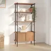 A tall, narrow bookshelf with wooden shelves and a cabinet at the bottom, set against a white wall with natural light casting shadows. Produktbild-Vorschau