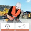 A construction worker wearing a hard hat and safety vest operates a jackhammer in a quarry. Produktbild-Vorschau