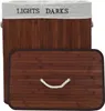 A laundry basket with two compartments, made of bamboo, with a lid. Produktbild-Vorschau