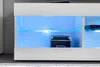 A white media console with blue LED lighting, showing a black storage box and a black electronic device. Náhľad obrázku produktu