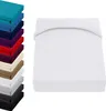 A stack of colorful fitted sheets is shown on the left, and a white fitted sheet is shown on the right. Produktbild-Vorschau