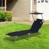 A black chaise lounge with a canopy sits on a green lawn in front of a house. Produktbild-Vorschau