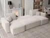 A modern sectional sofa in a living room setting, with a fireplace and curtains in the background. Produktbild-Vorschau