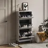 A shoe cabinet with multiple flip-down drawers is shown in a room with a door and a chair. Produktbild-Vorschau