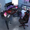 A gaming setup with a desk, chair, computer, and accessories. Produktbild-Vorschau