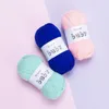 Three balls of yarn on a split background of pink and purple. Podgląd zdjęcia produktu