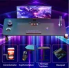 A gaming desk setup with a monitor, keyboard, mouse, and accessories, presented with a vibrant, futuristic background. Voir les images du produit