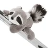 A plush raccoon toy clinging to a metal bar. Podgląd zdjęcia produktu
