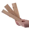 Hands holding several pieces of firewood. Produktbild-Vorschau