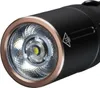Close-up view of the head of a black flashlight with a copper ring around the lens. Náhled obrázku produktu