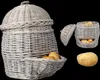 A wicker potato basket with a lid and a separate potato shown next to it. Produktbild-Vorschau