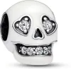 A close-up studio shot of a white skull charm with clear crystal accents. Produktbild-Vorschau