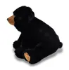A plush black bear toy is sitting on a white background. Produktbild-Vorschau