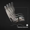 A gaming chair shown in multiple positions to demonstrate its reclining and rocking features against a black background. Náhľad obrázku produktu