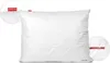 A white quilted pillow with red branding labels. Anteprima dell’immagine prodotto