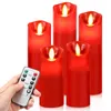 A hand holding a remote control in front of a set of five red LED candles. Produktbild-Vorschau