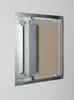 A close-up view of a metal inspection door installed in a wall. Produktbild-Vorschau