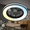 A ceiling fan with integrated LED lighting is shown from a low angle, with a dining area in the blurred background. Produktbild-Vorschau