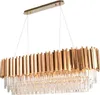 A rectangular chandelier with gold-colored metal accents and clear crystal elements, suspended by thin wires against a white background. Produktbild-Vorschau