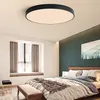 A bedroom with a bed, window, and ceiling light. Náhled obrázku produktu