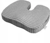 A grey orthopedic seat cushion with a mesh-like texture and a U-shaped cutout. Náhled obrázku produktu