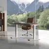 An office desk setup with a view of mountains and trees. Produktbild-Vorschau