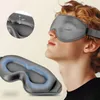 A person wearing a grey sleep mask, with a close-up inset of the mask's padding. Náhled obrázku produktu