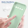 A hand is touching a light green phone case, with some fluffy white material in the background. Produktbild-Vorschau