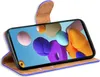 A blue flip case for a smartphone is shown open, displaying the phone's screen with a colorful abstract wallpaper. The case is made of a blue material with brown interior lining and a brown flap closure. Náhled obrázku produktu