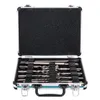 An open tool case containing a set of drill bits and chisels. Anteprima dell’immagine prodotto