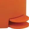 A close-up view of the bottom part of an orange trash can, showing the pedal mechanism. Náhľad obrázku produktu