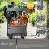 A family with a dog is using a KESSER bollerwagen outdoors on a paved path. Produktbild-Vorschau