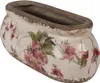 A ceramic planter with a floral design. Podgląd zdjęcia produktu