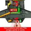 A hand is shown operating a toy car track set, with a red car on the track. Produktbild-Vorschau