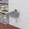 A utility sink and storage bins in a workshop or garage setting. Anteprima dell’immagine prodotto