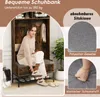 A woman is sitting on a shoe bench with storage compartments and hooks, with close-ups of the cushion material. Podgląd zdjęcia produktu